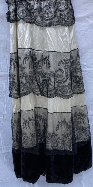 M Lot including:
-Ivory satin skirt, black...