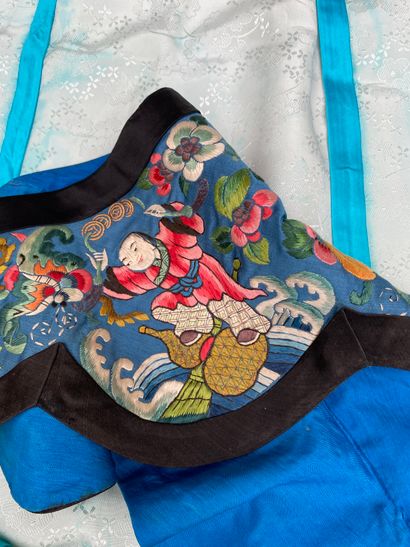 Black fabric jacket with blue piping, long...