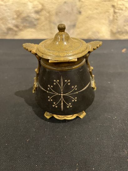 Black stone inkwell with ormolu frame, incised...