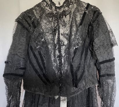 A Black silk and tulle ensemble with black...