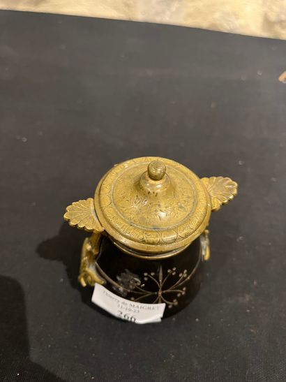 Black stone inkwell with ormolu frame, incised...