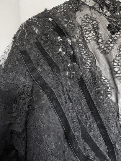 A Black silk and tulle ensemble with black...