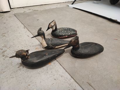 Set of four painted wood or cork decoys,...