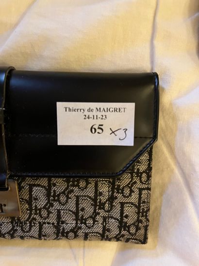 A wallet, a beige leather clutch bag and...