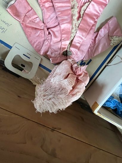 Set of doll clothes in wooden trunk, two...