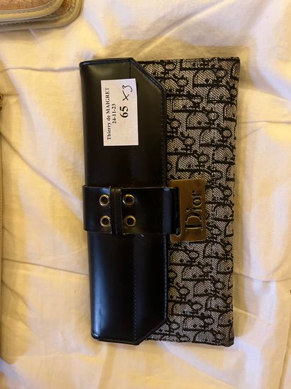 A wallet, a beige leather clutch bag and...