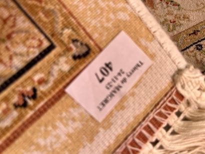 Wool and silk carpet, beige background with...