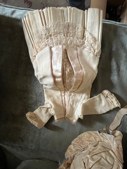 Set of doll clothes in wooden trunk, two...