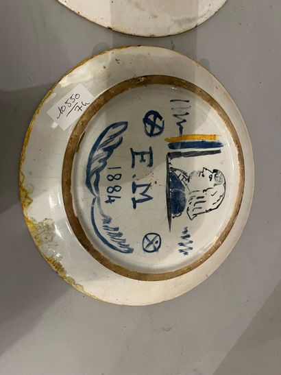 Set of two ceramic plates decorated with...