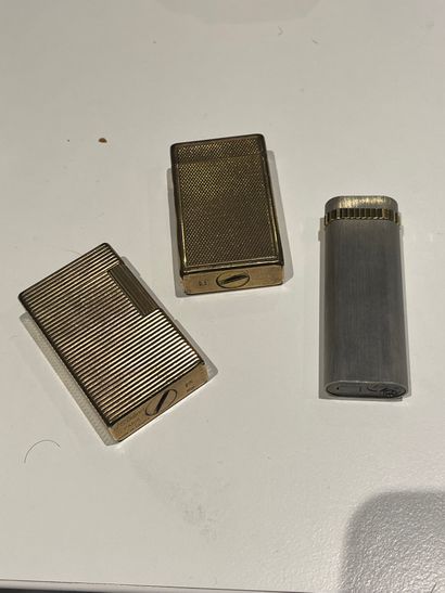 Set of three gilt-plated metal Dupont canes,...