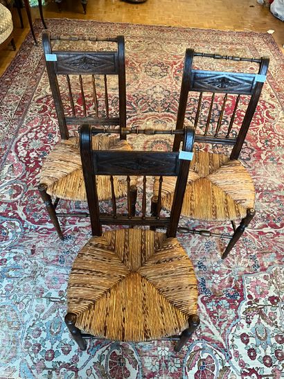 Six chairs with inverted backs, carved with...