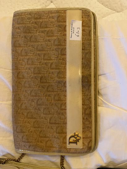A wallet, a beige leather clutch bag and...