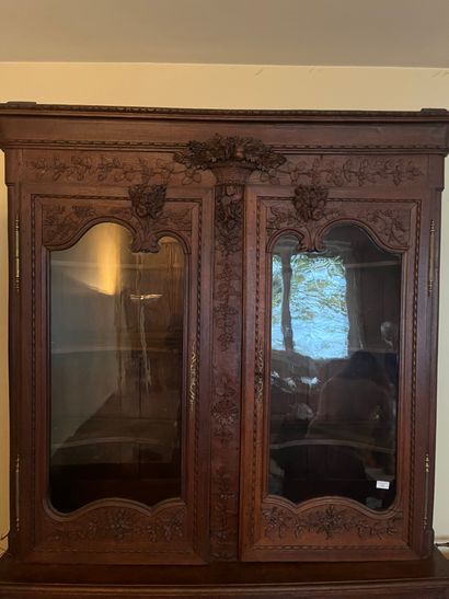 Two-part sideboard in oak carved with flowers
Circa...
