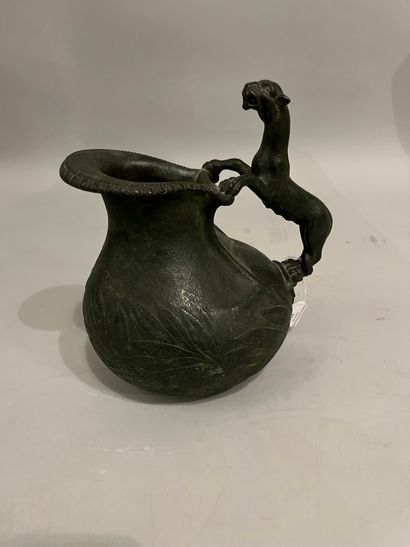 Bronze coffee pot depicting a panther in...