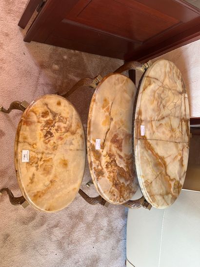 Three oblong nesting tables, onyx tops (accidents)
Louis...