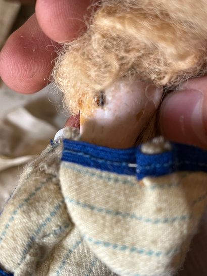 Set of doll clothes in wooden trunk, two...