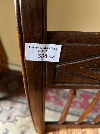 Six chairs with inverted backs, carved with...