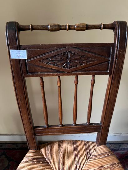 Six chairs with inverted backs, carved with...