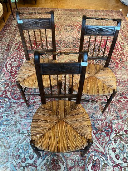 Six chairs with inverted backs, carved with...