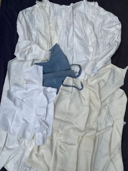 Large lot of white or blue aprons, blouses...