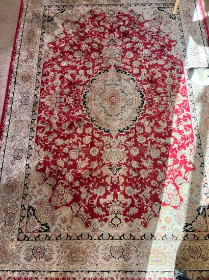 Red carpet with central medallion decorated...