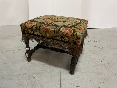 Turned wood stool joined by a spacer.
Upholstered...