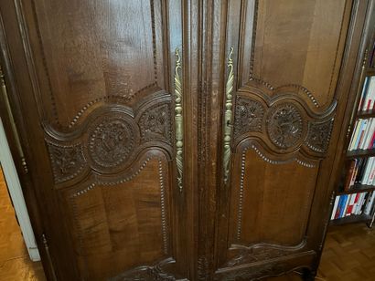 Norman cabinet with carved decoration of...