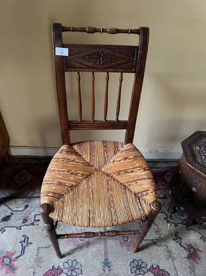 Six chairs with inverted backs, carved with...