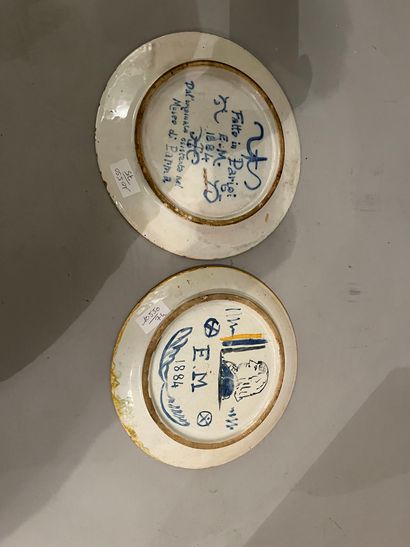 Set of two ceramic plates decorated with...