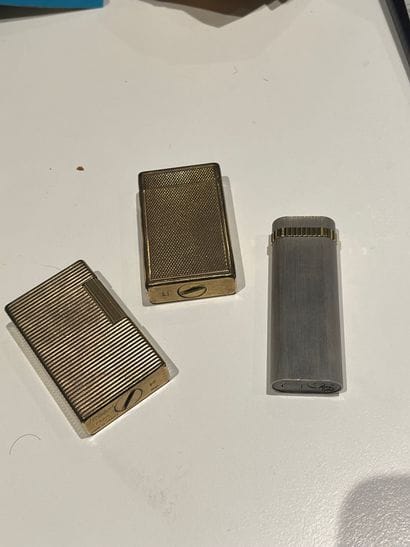 Set of three gilt-plated metal Dupont canes,...