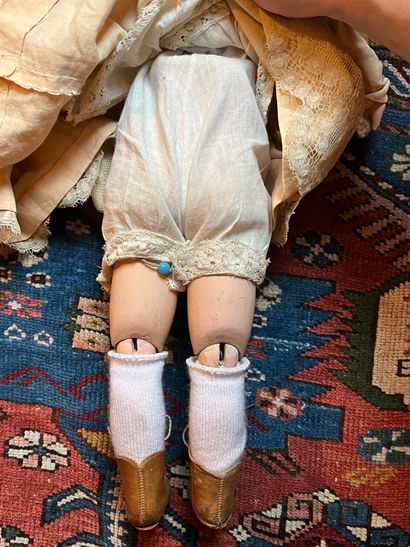 Doll
Bisque head, open mouth, movable eyes,...