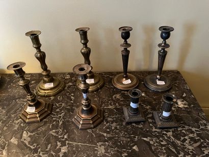Nine metal torches, including silver-plated...