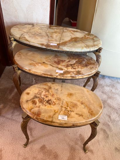 Three oblong nesting tables, onyx tops (accidents)
Louis...