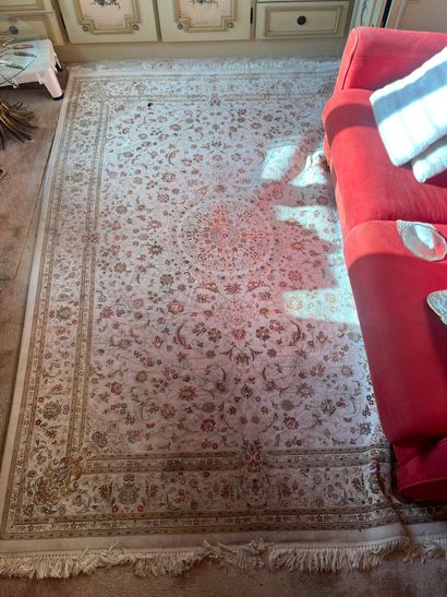 Wool and silk carpet, beige background with...