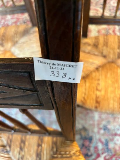 Six chairs with inverted backs, carved with...