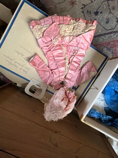 Set of doll clothes in wooden trunk, two...