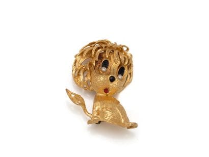 Brooch in chased 750 thousandths gold, stylizing...