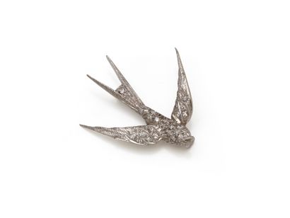 Small brooch in finely chased 750 thousandths...