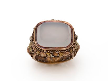A man's three 585-thousandths gold ring centered...