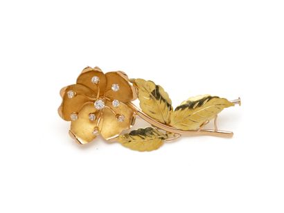 Two 750 thousandths gold brooch stylizing...