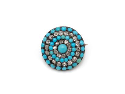 Broche en métal, de forme ronde habillée...