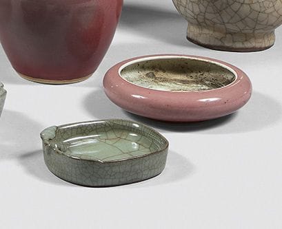 CHINA
Two porcelain brushes, one with a celadon...