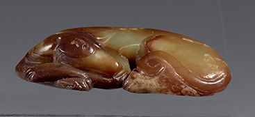 CHINA - 20th century
Celadon and brown jade...