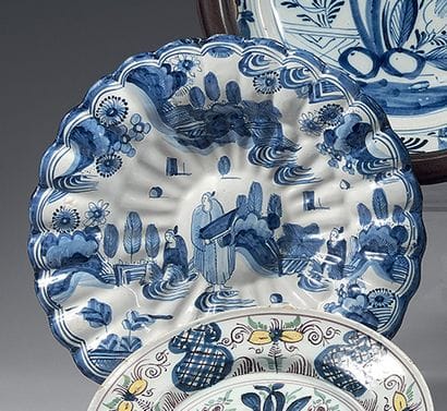 DELFT
An earthenware gadrooned dish decorated...