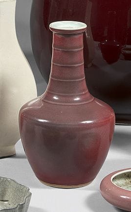 CHINA
Vase with long narrow neck surrounded...