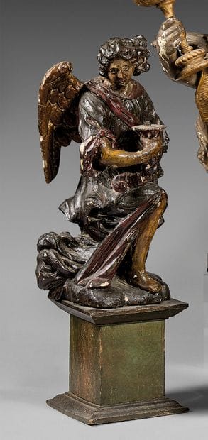 Kneeling ceroferous angel carved in the round...