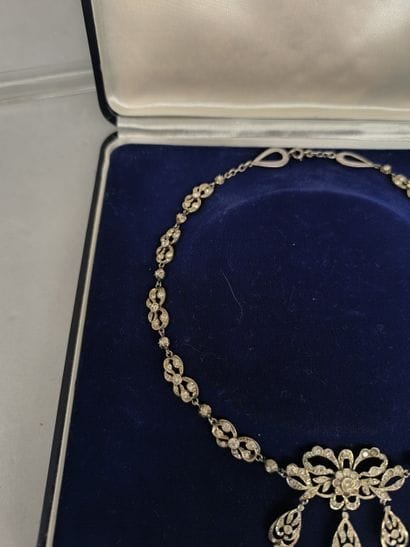 Fancy drapery necklace decorated with bows,...