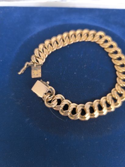 Gourmette bracelet in 750°/°° gold, openwork...