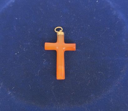 Carved amber cross mounted in a gilded metal...