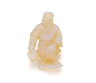 Engraved opal netsuke, featuring a traditional...